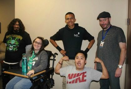 DMC. Picture of instructor and 4 youth consumers. One youth is flexing his muscles. transition services
