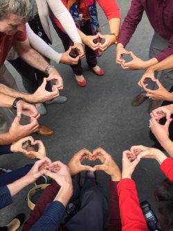 Picture of 11 sets of hands formed into hearts. DMC Connect