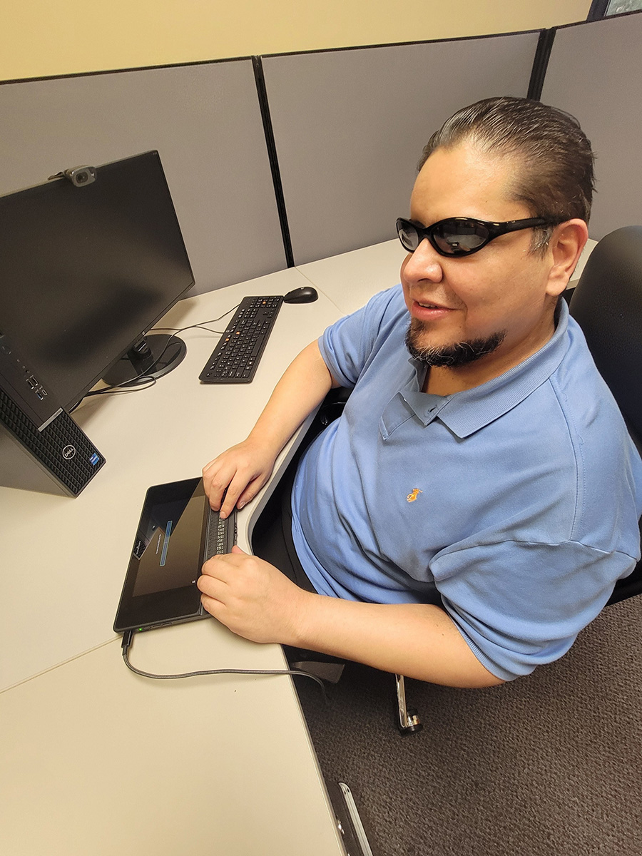 Alan using Braille Note Display AT device