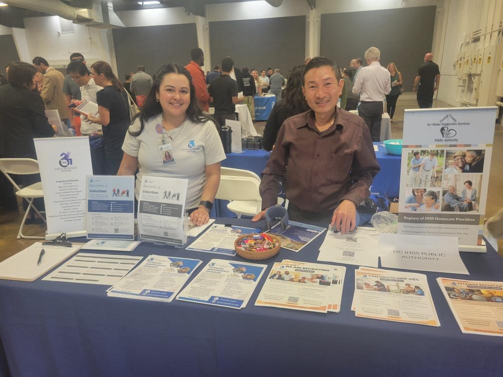 Raquel Velarde, DMC Volunteer Coordinator and Kevin Dinh, DMC PAS Recruitment Specialist doing outreach from DMC booth at Career Fair