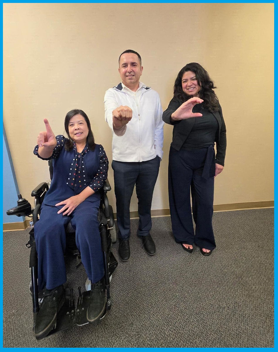 DMC's Admin Team signing D-M-C in ASL finger-spelling
 L-R: Christine Nguyen, DMC Financial Administrator; Miguel Escarzaga, DMC Operations and IT Administrator and Yaquelin Castro, DMC Billing Administrator.
