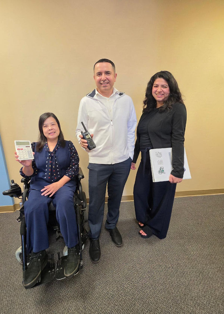 DMC's Admin Team with essential job item props used in their respective roles L-R: Christine Nguyen, DMC Financial Administrator; Miguel Escarzaga, DMC Operations and IT Administrator and Yaquelin Castro, DMC Billing Administrator.