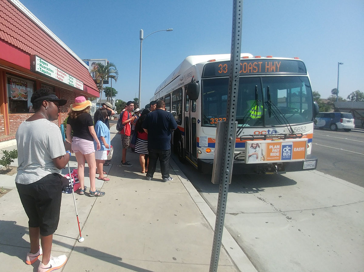 Youth Summer Academy participants boarding the bus with the support of MMP staff.