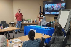DEAF-FUN-DAY-2023-Photo-1-DMCs-Deaf-Services-Advocates-doing-presentation-with-Lead-Advocate-sharing-why-DMC-is-number-one