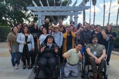 Photo-14-Pictured-–-Team-DMC-Gathered-in-a-group-outside-with-blue-sky-white-clouds-and-trees-in-the-background-smiling-acting-silly