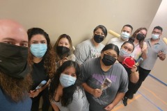 Photo-5-Team-DMC-Painting-Crew-huddled-in-a-group-photo-with-COVID-masks-on-before-starting-the-painting-process