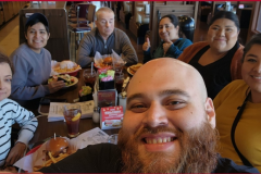 Photo-6-Pictured-Team-DMC-at-Rubys-Diner-of-Anaheim-on-Day-1-Attitude-of-Gratitude-Giving-Week-Fundraiser-–-team-is-gathered-around-the-dining-table-eating-lunch