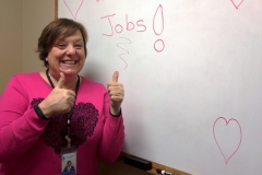 DMC Job Developer, Pam with sign that says we love jobs