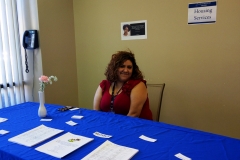 DMC Staff Marisol at Housing Table