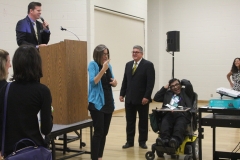 Auctioneer interpreter and Bhumit Shah during heads and tails game