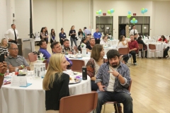 Picture of audience with Mike Beers in fron giving the peace sign