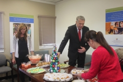 Staff and guests at refreshment table