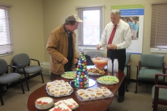 Tim Margeson with guest at refreshment table