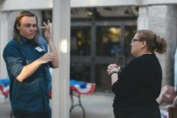 oung-man-in-coversation-using-American-Sign-Language
