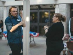 DMC Young-man-in-coversation-using-American-Sign-Language services for the deaf