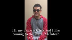 Man wearing sunglasses smiling at camera.
