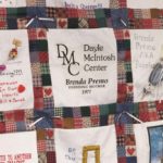 Picture of Quilt with square that says, DMC, Dayle McIntosh Center, Brenda Premo, Founding Mother, 1977