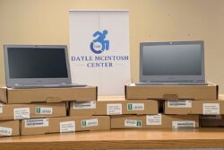 Two laptops in boxes at Dayle McIntosh Center.