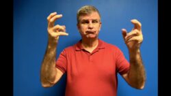 Man signing in American Sign Language.