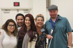 Group of people smiling for a photo.