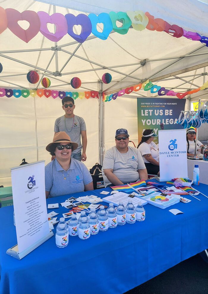 The Dayle McIntosh Staff representing the organization at a booth out in the community during Pride 2023