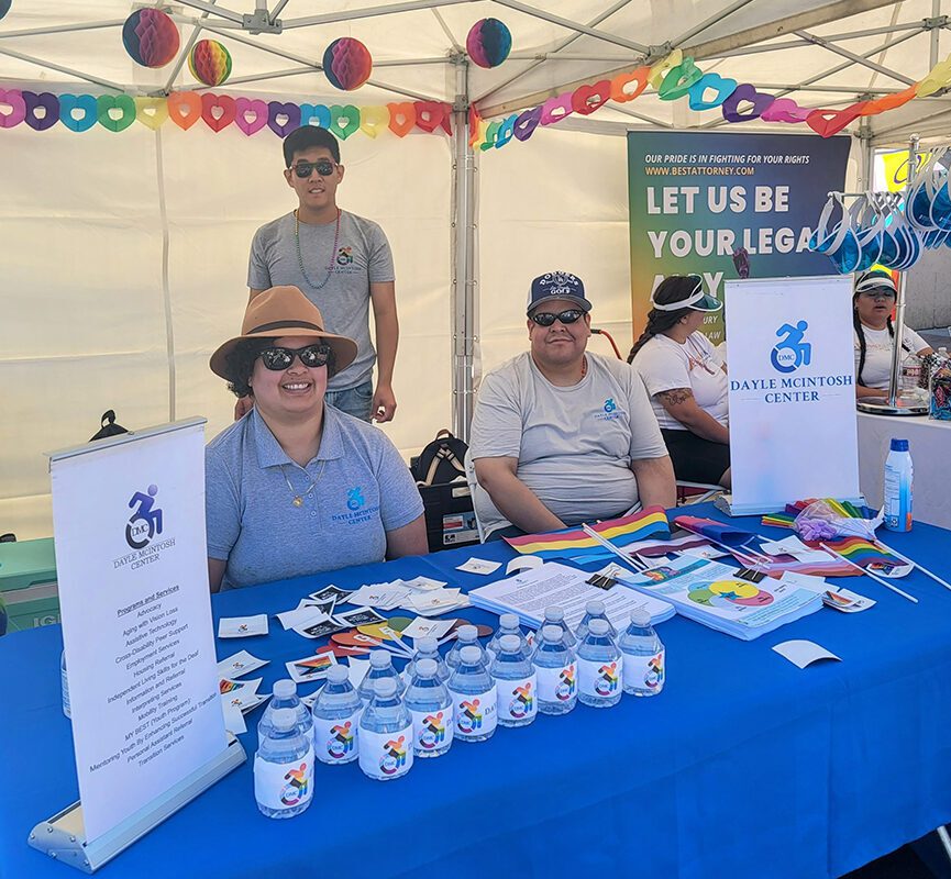 The DMC Team is pictured working in the community, providing outreach, information and resources to the community at a recent LGBT+ Pride event in OC.