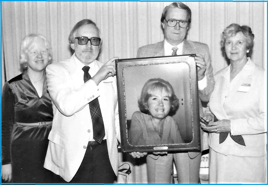 Photo left-to-right, Brenda Premo, Allan Kennedy, and Dayle’s parents Fred & Irene McIntosh holding Dayle’s framed photo