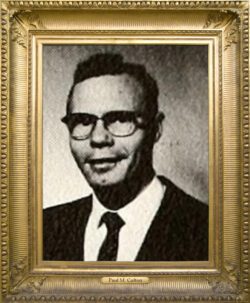 Dr. Paul M. Culton is smiling softly, wearing glasses, business suit, shirt and tie. The photo is from his high school yearbook.