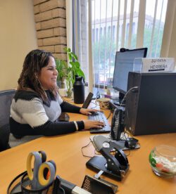 Pictured, Juanita Herrera doing consumer case intake for Assistive Technology services