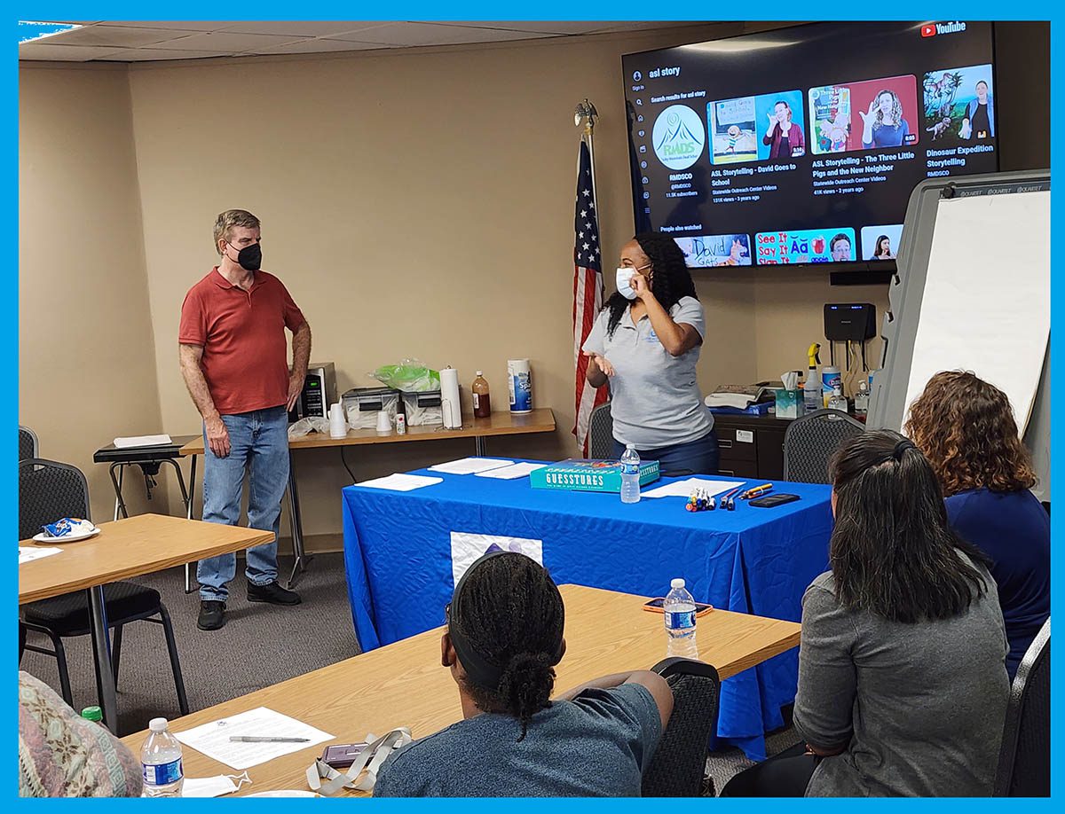 DMC Deaf Fun Day with Pamela leading the presentation to group of attendees.