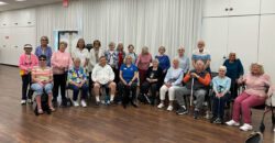 DMC Team Member Jeanne and the participants at Laguna Woods Vision Club all smiling after a wonderful peer support conversation.)