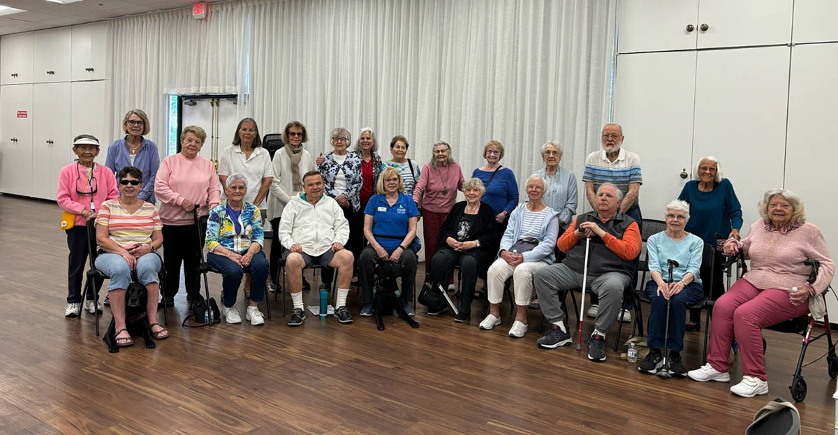 DMC Team Member Jeanne and the participants at Laguna Woods Vision Club all smiling after a wonderful peer support conversation.)