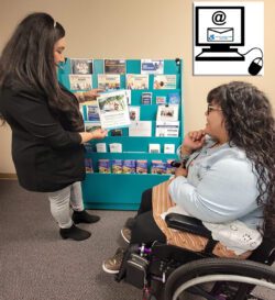 Front office team members Bianca happily showing Nelly a DMC flyer from the teal blue information kiosk at the DMC front office and Top RIght is a Computer screen with mouse showing Dayle McIntosh Center’s wheelchair logo in blue words on an outline of an envelope. The art is on the screen of a drawn computer, with an “at” symbol indicating that a consumer can join our mailing list via email.
