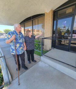 Pictured DMC Board President leading the way to the front door of DMC through ramp access.