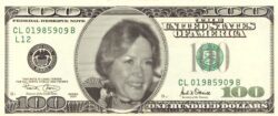 Photo of Dayle McIntosh in the center of a $100 bill.