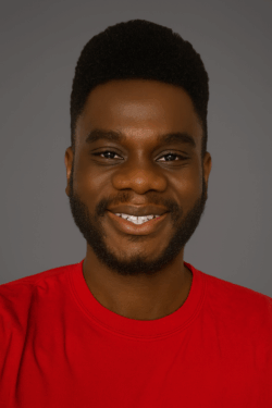 Tolu Adedoja Board Member At-Large smiling looking straight on in front of grey background wearing a bright red shirt.