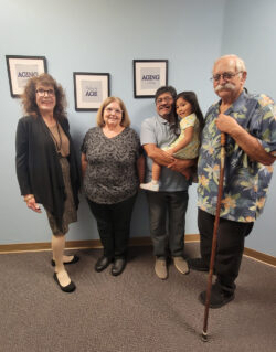 Older Men and Women with Blue Wall and Aging Art in background