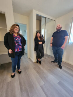 Housing Team inside vacant apartment bedroom