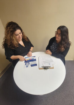 Community Transitions Team Mari and Lizeth at round table discussion consumer transitions plan