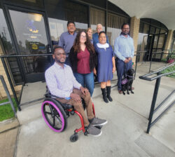 DMC Board of Directors on Ramp in December 2025 after annual meeting outside DMC. L-R: Front Row: Tolu Adedoja, Gracie Doran, Grace Yhap and Griffin Dooley. Back row: David Flores, Suzanne Alle and Tony Clement.