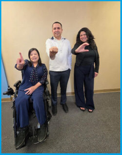 DMC's Admin Team signing D-M-C in ASL finger-spelling L-R: Christine Nguyen, DMC Financial Administrator; Miguel Escarzaga, DMC Operations and IT Administrator and Yaquelin Castro, DMC Billing Administrator.