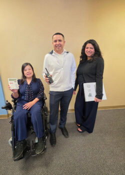 DMC's Admin Team with essential job item props used in their respective roles L-R: Christine Nguyen, DMC Financial Administrator; Miguel Escarzaga, DMC Operations and IT Administrator and Yaquelin Castro, DMC Billing Administrator.
